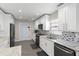 Bright kitchen featuring stainless appliances, granite countertops, and tile backsplash at 9105 Camino Villa Blvd, Tampa, FL 33635