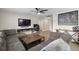 Inviting living room with a large sectional sofa, media console, and contemporary furnishings at 9105 Camino Villa Blvd, Tampa, FL 33635