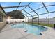 The screened-in swimming pool features a large deck area perfect for entertaining and relaxation at 9105 Camino Villa Blvd, Tampa, FL 33635