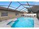 Relax in the privacy of your screened-in pool, complete with ample deck space and outdoor amenities at 9105 Camino Villa Blvd, Tampa, FL 33635