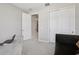 Bedroom with a closet and a comfortable seating area at 9107 Rally Spring Loop, Wesley Chapel, FL 33545