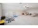 Spacious bonus room perfect for a home gym with ceiling fan and lots of light at 9107 Rally Spring Loop, Wesley Chapel, FL 33545