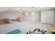Large bonus room featuring lots of space, a ceiling fan and comfortable furniture at 9107 Rally Spring Loop, Wesley Chapel, FL 33545