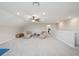 Spacious and bright bonus room featuring a ceiling fan and comfortable furniture at 9107 Rally Spring Loop, Wesley Chapel, FL 33545