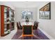 Dining room featuring a modern chandelier and a stylish display case at 9107 Rally Spring Loop, Wesley Chapel, FL 33545