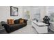 Home office with modern desk, sleek seating, and comfortable seating area at 9107 Rally Spring Loop, Wesley Chapel, FL 33545