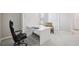 Compact office space with desk, office chair and natural light from the window at 9107 Rally Spring Loop, Wesley Chapel, FL 33545