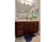 Bathroom featuring a large vanity, mirror, and accent decorations throughout at 10002 Key Haven Rd # 503, Seminole, FL 33777
