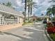 Community entrance with prominent signage and manicured landscaping at 10002 Key Haven Rd # 503, Seminole, FL 33777