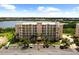 An aerial view showcasing the condos, waterfront views, and parking areas at 10002 Key Haven Rd # 503, Seminole, FL 33777