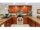 Well-equipped kitchen with stainless steel appliances, granite countertops, and ample cabinet space for storage at 10002 Key Haven Rd # 503, Seminole, FL 33777