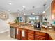 Spacious kitchen with granite countertops, stainless steel appliances, and bar seating overlooking a beautiful view at 10002 Key Haven Rd # 503, Seminole, FL 33777