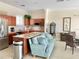 Open-concept kitchen and living area with modern appliances and comfortable seating at 10002 Key Haven Rd # 503, Seminole, FL 33777