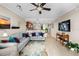 A modern living room layout with open kitchen view, comfortable sofas, and bright natural light at 10002 Key Haven Rd # 503, Seminole, FL 33777