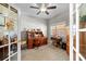 Bright office with vintage wooden desk, chair, sewing machine, and natural light, perfect for work at 10002 Key Haven Rd # 503, Seminole, FL 33777