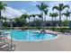 Inviting pool area with tropical landscaping, perfect for relaxation and recreation at 10002 Key Haven Rd # 503, Seminole, FL 33777