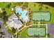 Aerial shot of the community pool, tennis courts, and clubhouse at 10002 Key Haven Rd # 503, Seminole, FL 33777
