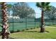 Outdoor tennis court with green fence at 10002 Key Haven Rd # 503, Seminole, FL 33777