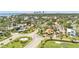 An aerial view of a charming neighborhood with mature trees and a traditional home in St. Petersburg, Florida at 101 Bandera Ne Way, St Petersburg, FL 33704