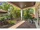 Relaxing outdoor balcony with brick flooring and lush tropical landscaping for a private retreat at 101 Bandera Ne Way, St Petersburg, FL 33704