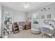 bedroom with unique lofted bed, comfortable seating, and stylish decor at 101 Bandera Ne Way, St Petersburg, FL 33704