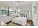 Bright bedroom with natural light, hardwood floors, and simple yet elegant décor at 101 Bandera Ne Way, St Petersburg, FL 33704