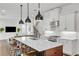 Spacious modern kitchen with island seating, stainless appliances, and open floor plan at 101 Bandera Ne Way, St Petersburg, FL 33704