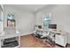 Bright home office with hardwood floors, natural light, and two desk setups at 101 Bandera Ne Way, St Petersburg, FL 33704