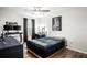 Cozy bedroom featuring a dark color palette, a desk, and ample space, perfect for relaxation and productivity at 10624 Aldo Moro Dr, Wimauma, FL 33598