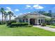 Community clubhouse with well-manicured lawn, providing residents with a gathering and recreation space at 10624 Aldo Moro Dr, Wimauma, FL 33598