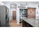 Spacious pantry with wooden sliding door and lots of storage space at 10624 Aldo Moro Dr, Wimauma, FL 33598