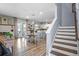 Bright and airy living space with an open floor plan leading to a modern kitchen and dining area at 10624 Aldo Moro Dr, Wimauma, FL 33598