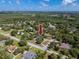 Aerial view of home in a treed neighborhood; property is indicated with arrow at 11203 Egret Nest Ct, Riverview, FL 33569
