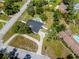 Aerial view of a single-Gathering home featuring a pool, mature trees and a well manicured lawn at 11203 Egret Nest Ct, Riverview, FL 33569