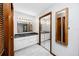 Bathroom featuring double vanity with granite countertop and a large mirror at 11203 Egret Nest Ct, Riverview, FL 33569