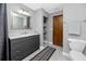 Bathroom with a modern vanity, tiled floors and walls and a toilet at 11203 Egret Nest Ct, Riverview, FL 33569