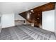 Upstairs bonus room with wood paneled ceiling, gray carpeting, and overlooking the floor below at 11203 Egret Nest Ct, Riverview, FL 33569