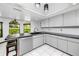 Bright, modern kitchen with a peninsula bar, tile flooring, and ample counter space for cooking and entertaining at 11203 Egret Nest Ct, Riverview, FL 33569