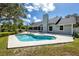 Backyard featuring a beautiful in-ground pool, patio, and screened-in porch at 11203 Egret Nest Ct, Riverview, FL 33569