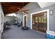Cozy screened-in porch with a ceiling fan, wooden beams, and access to the outdoors at 11203 Egret Nest Ct, Riverview, FL 33569