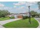 Attractive single-Gathering home with a brown garage door and well-manicured lawn at 11501 Cerca Del Rio Pl, Temple Terrace, FL 33617