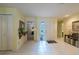 Welcoming home foyer with tile flooring and sunny yellow walls at 11501 Cerca Del Rio Pl, Temple Terrace, FL 33617
