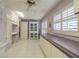 Spacious laundry room featuring lots of cabinetry, counter space, and a utility sink at 11501 Cerca Del Rio Pl, Temple Terrace, FL 33617