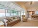 Sunroom leading to the kitchen boasts a skylight, and large windows offering plenty of natural light at 11501 Cerca Del Rio Pl, Temple Terrace, FL 33617