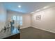 Simple office space with a desk and natural light coming from the window at 11501 Cerca Del Rio Pl, Temple Terrace, FL 33617