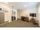 Carpeted office space with built-in closet and desk at 11501 Cerca Del Rio Pl, Temple Terrace, FL 33617