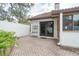 Private brick patio with access via sliding glass doors, perfect for outdoor enjoyment at 11501 Cerca Del Rio Pl, Temple Terrace, FL 33617