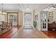 Inviting foyer with decorative tile flooring, high ceilings, and an adjacent office and dining room at 11729 Newberry Grove Loop, Riverview, FL 33579