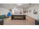 Spacious game room with air hockey table, ping pong table, and comfortable seating, perfect for entertaining guests at 11729 Newberry Grove Loop, Riverview, FL 33579