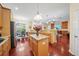 Open concept kitchen and dining area with granite countertops and stainless steel appliances at 11729 Newberry Grove Loop, Riverview, FL 33579